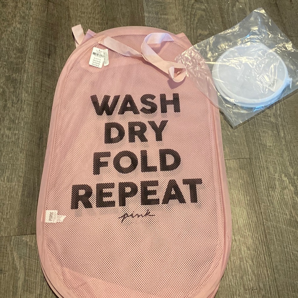 Foldable, pink mesh hamper with handles